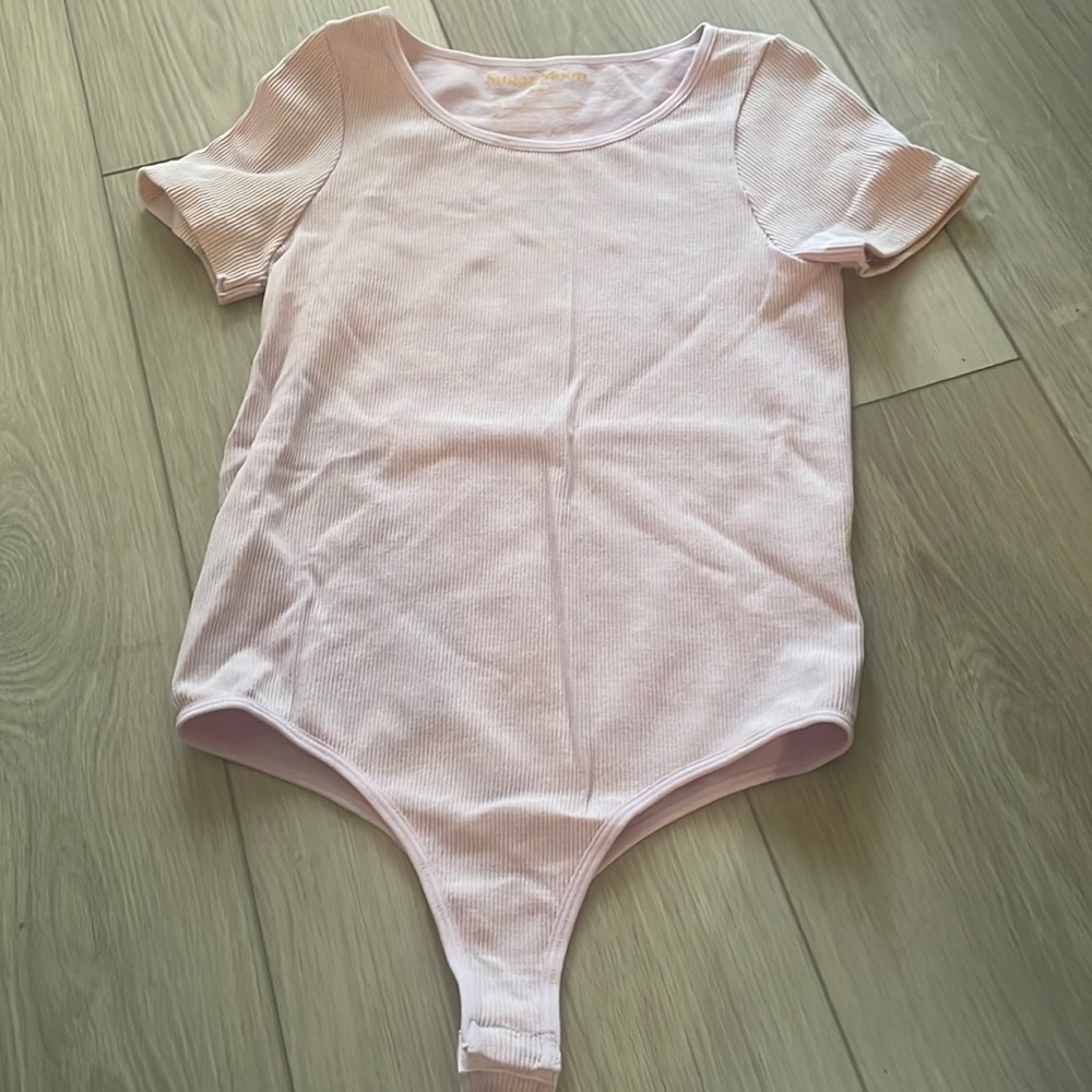 Sugar moon women’s pink ribbed body suit size small/medium